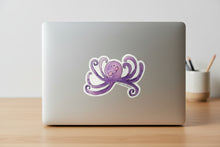 Load image into Gallery viewer, Purple octopus sticker with a smile on a white background, branded 'Laura Kelly Designs'.
